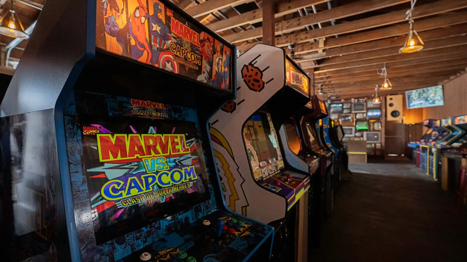Retro arcade machines lined up for guest entertainment