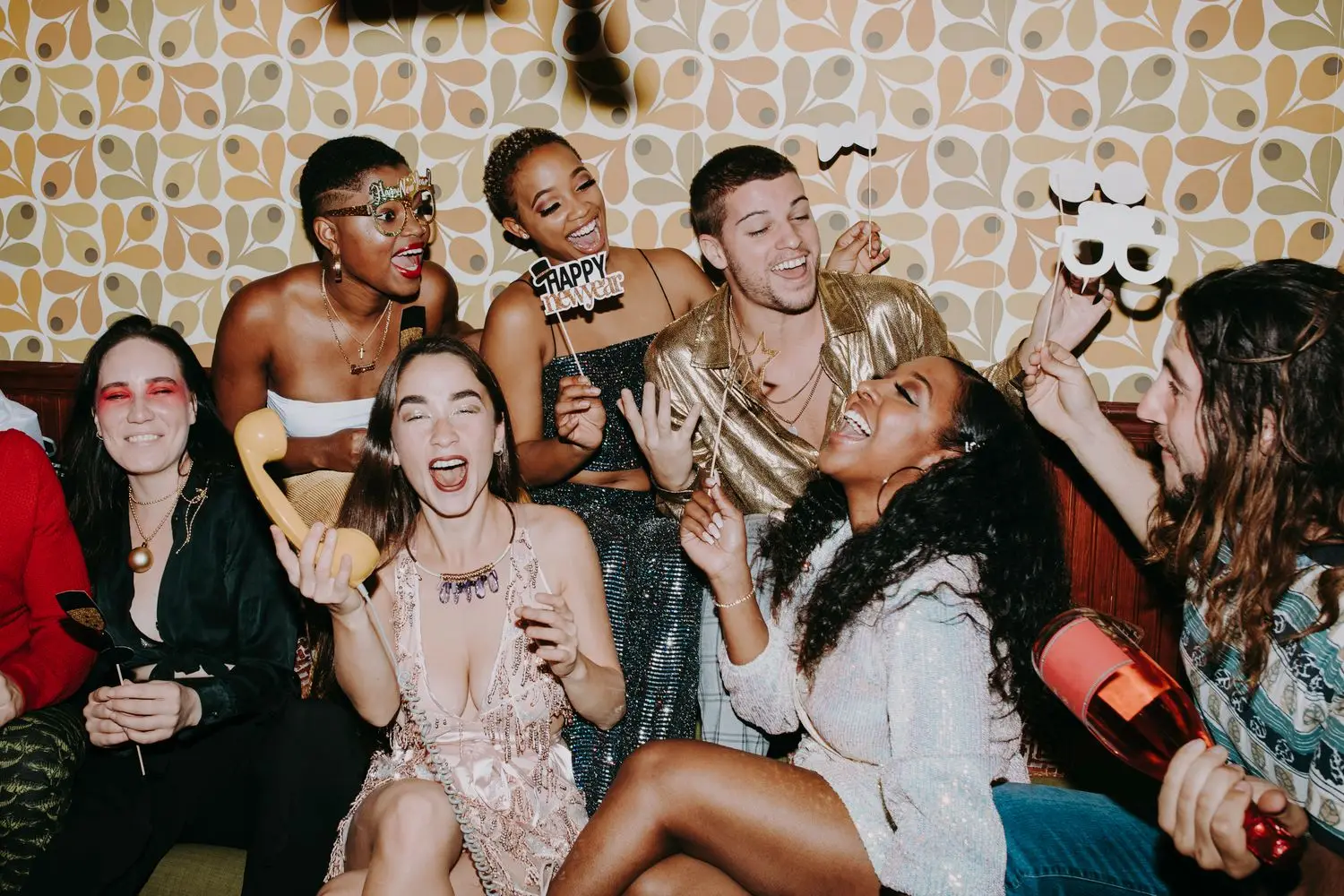 Group of guests posing together in a photo booth area