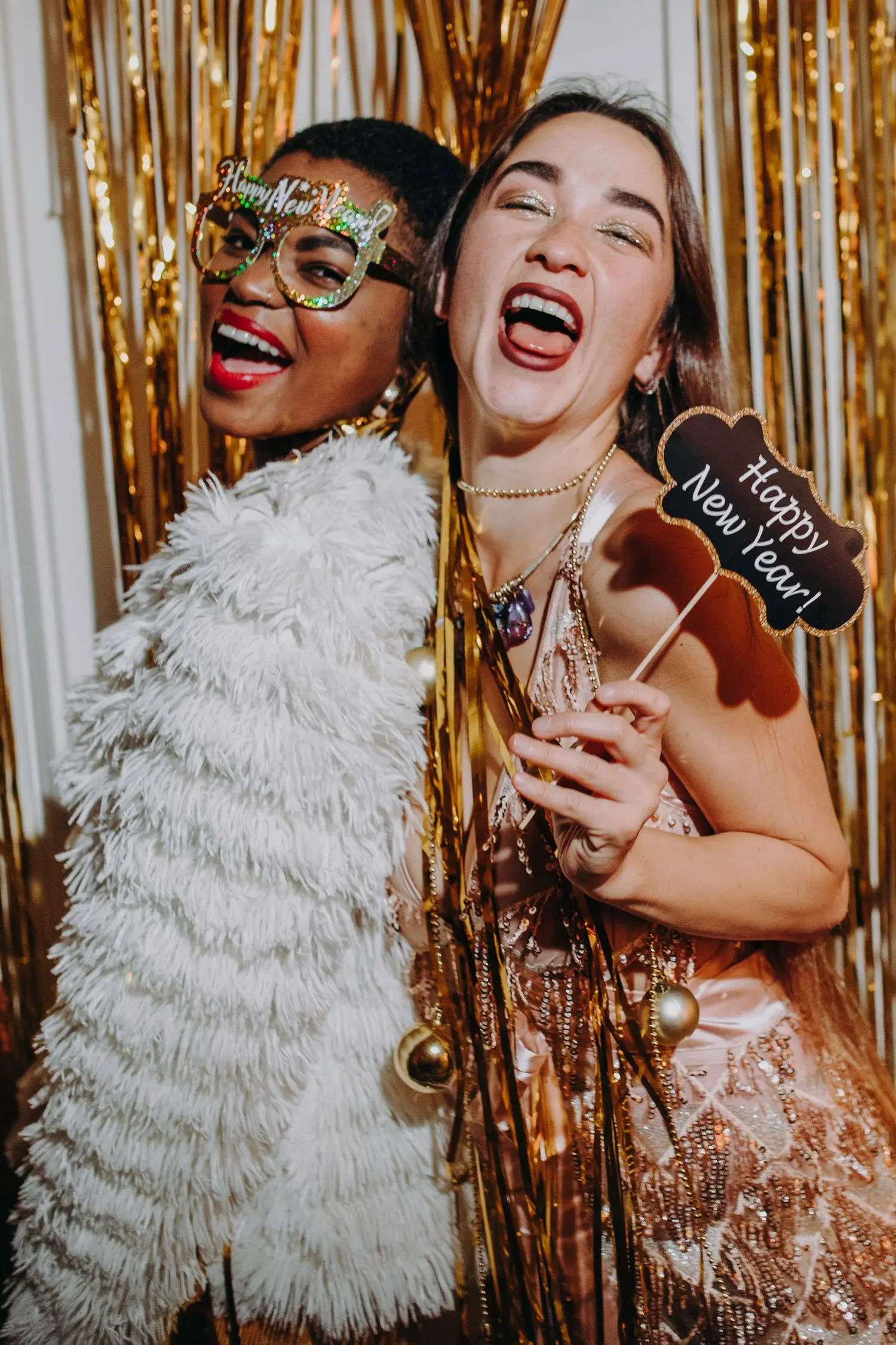 Guests posing in a photo booth area with decorative backdrop