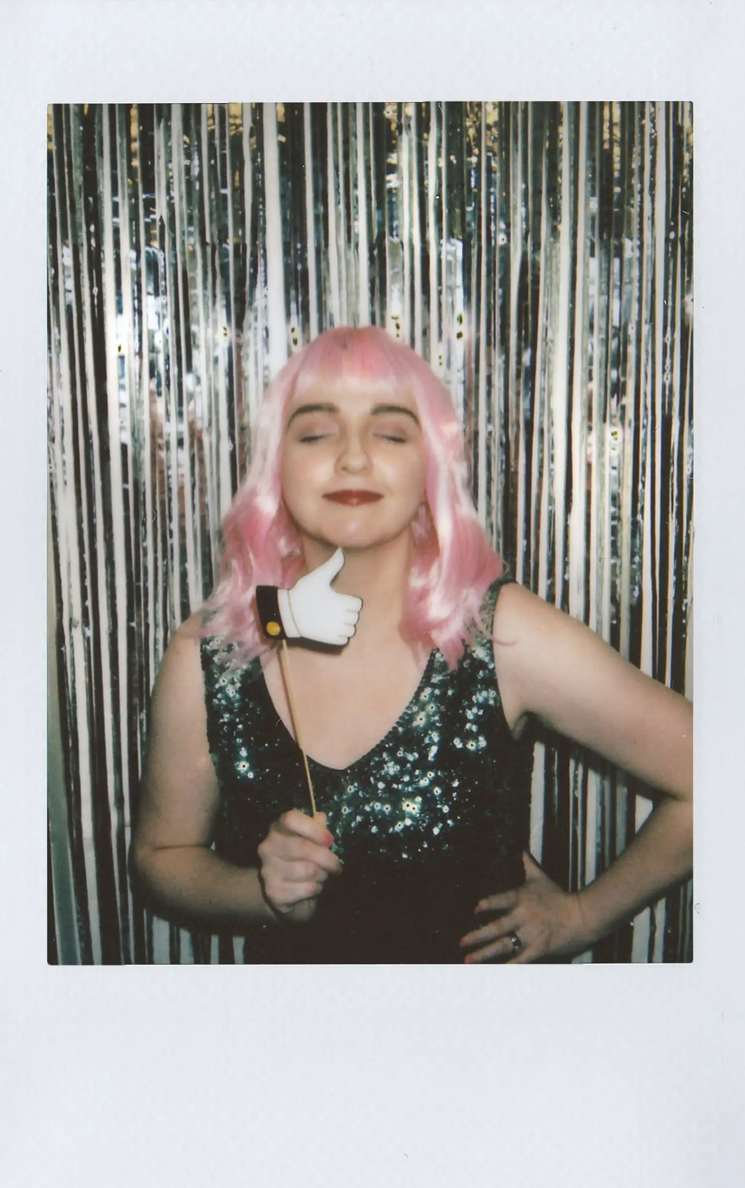 Portrait taken in front of a shimmering photo backdrop