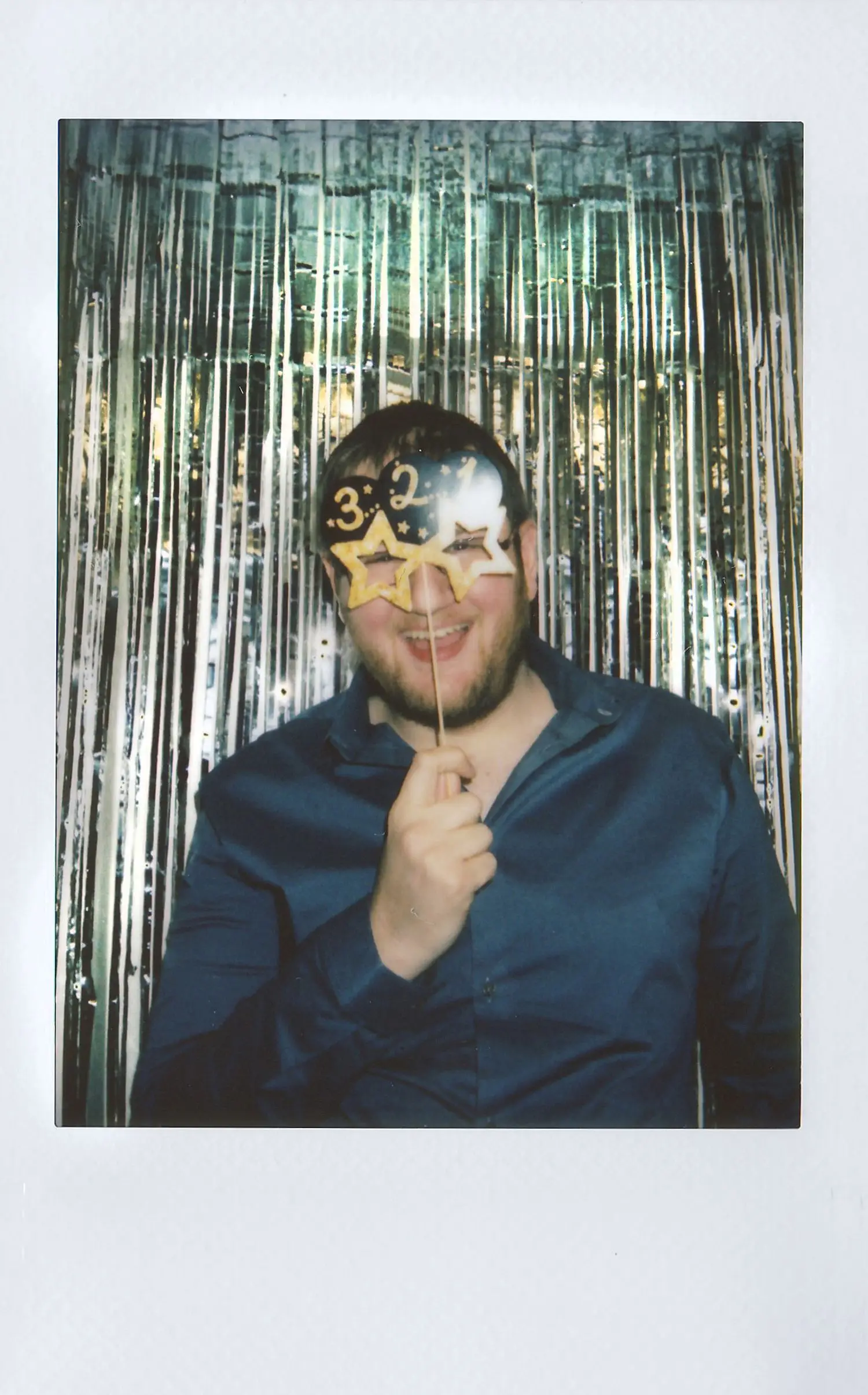 Guest portrait in a decorative photo booth setup